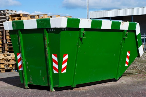 Skip Hire Mayfair branded vehicle and skips at a residential site