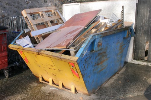 Workers segregating demolition waste materials