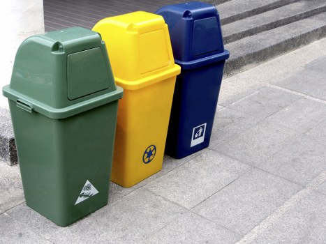 Waste materials being loaded into a skip bin