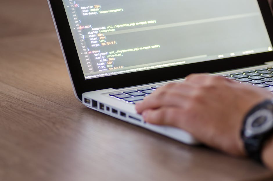 A computer screen displays a web development code editor with visible lines of HTML markup. The code includes tags such as <!DOCTYPE html>, <html>, <head>, <title>, and <lin